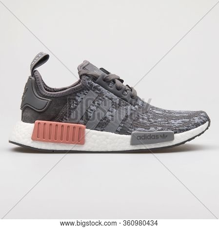 Vienna, Austria - August 22, 2017: Adidas Nmd R1 Grey And Rose Sneaker On White Background.