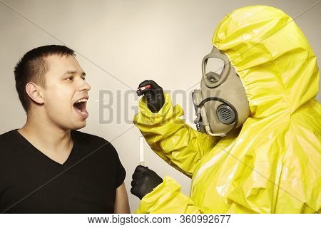 Specialist In Virus Protective Suit Getting Mucous Membrane Smear For Testing