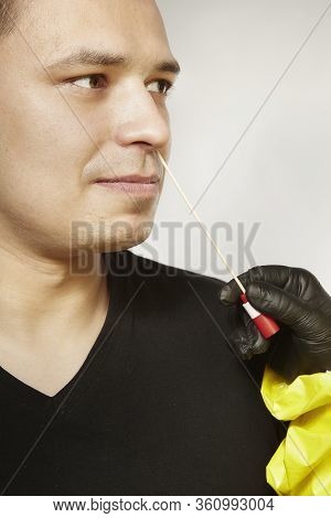 Specialist In Virus Protective Suit Getting Mucous Membrane Smear For Testing