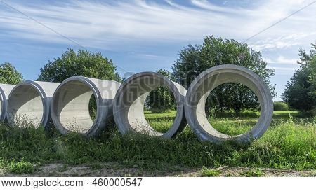 Reinforced Concrete Storm Sewer Pipes Of Large Diameter Stacked At A Construction Site. Sewer Large 