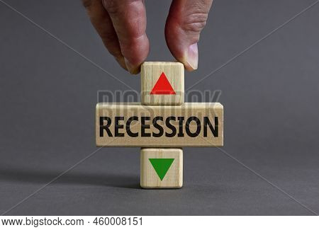 Recession Up Or Down Symbol. Concept Word Recession And Up And Down Arrow On Wooden Blocks On A Beau