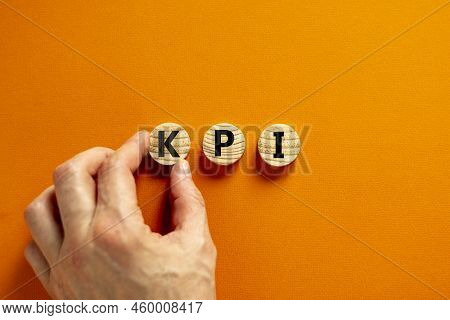 Kpi, Key Performance Indicator Symbol. Concept Word Kpi, Key Performance Indicator On Wooden Circles