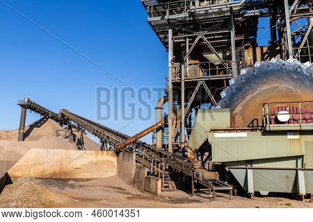 Close-up Detail Part Of Heavy Metal Construction Of Open Pit Gravel Plant Sand Quarry Big Rusty Roto