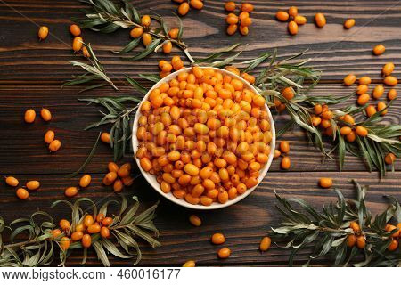 Fresh Ripe Sea Buckthorn On Wooden Table, Flat Lay