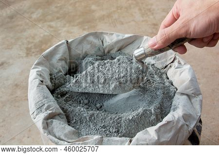 Cement Powder With Trowel Put In Bag Package