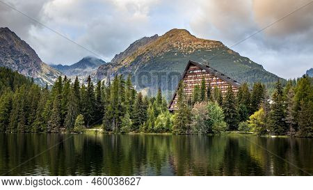 The Beautiful View Of Traditional Mountain Hotel Mirroring On Surface Of Strbske Pleso Lake, Vysoke 