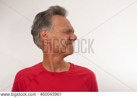 Mature Man 60plus Stretching Out His Neck For Pain Relief