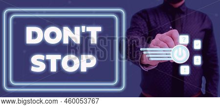 Sign Displaying Don T Not Stop. Word Written On Continue What Had Been Doing Without Rendering A Del