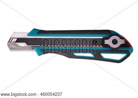 Green And Black Office Cutter Knife With A Snap-off Blade And A Locking Device Isolated Over White B