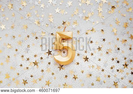 Number Five 5 Golden Celebration Birthday Candle On Festive Background. Five Years Birthday. Concept