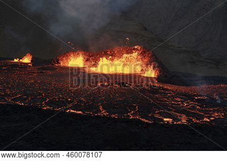 Volcano Eruption At Meradalir Near Fagradalsfjall, Iceland. Erupting Magma And Flowing Lava At Night