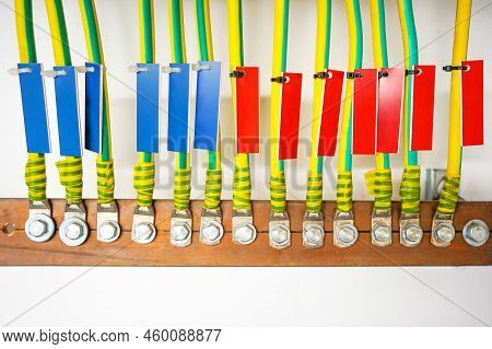 Electrical High Voltage Ground Copper Cables On Wall. Grounding Electric Bar. Cables Connected To El