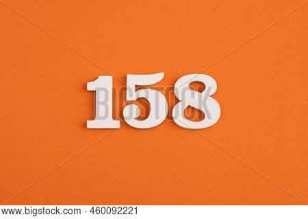 White Wooden Number 158 On Eva Rubber Orange Background