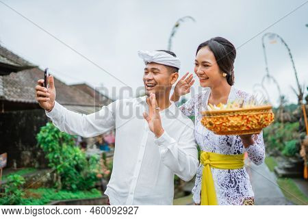 Balines Couple Make A Video Call During Holy Day Of Galungan