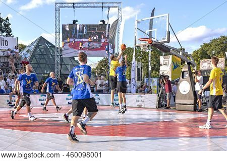 Latvia, Riga, August, 2022: Urban Basketball Players Playing Basketball On Sports Court In Riga, Lat