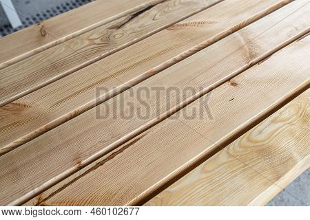 Raw Planed Pine Wooden Beams, Dimensions 100x100mm, Lying Next To Each Other.
