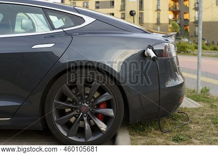 Minsk, Belarus - August 12, 2022: Tesla Car Charges The Electric Motor At The Charging Station On Th