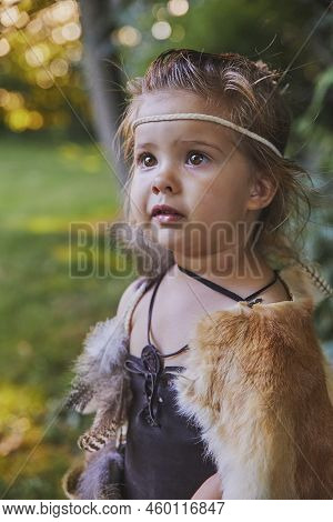 Cute Baby Dressed In The Clothes Of Primitive People