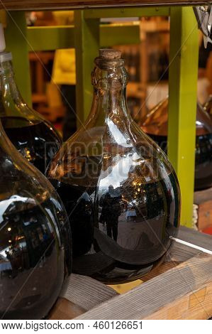 Big Bottles With White And Red Wine Austrian Vinegar Made From Local Grapes On Market In Vienna, Aus