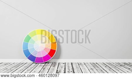 Ryb Color Wheel On Wooden Floor Against A Gray Wall With Copy Space 3d Render Illustration