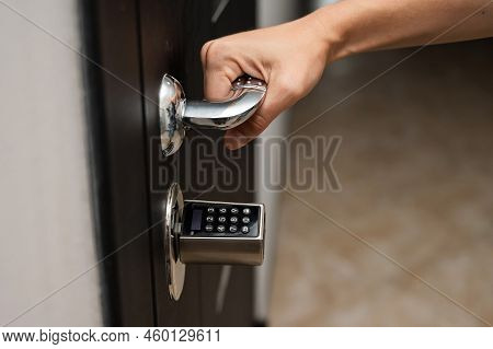 Woman Opens The Combination Lock On The Door To The Apartment. Keyless Entry.