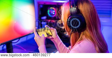 Asian Woman Live Stream She Play Video Game Via Smartphone At Home Neon Lights Living Room, Gamer Pl