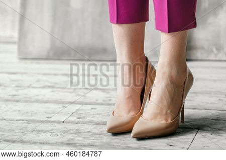 Young Businesswoman In High Heel Shoes. Beautiful Woman Feet. Model, General Manager In Pink Suit. D