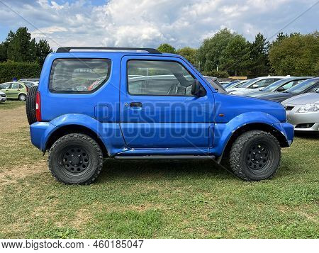 Velenje, Slovenia - August 12, 2022: Blue Suzuki Jimny Pakkerd On A Public Parking Lot. Nobody In Th