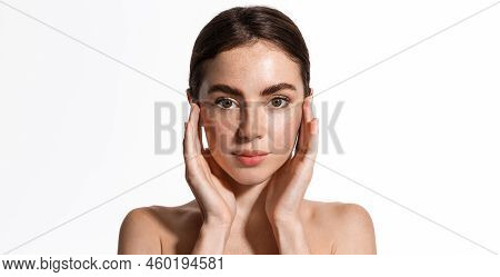 Beauty Face And Spa. Woman With Freckles, Clean Nourished Skin, Biting Lip And Look Aside. Girl Mode