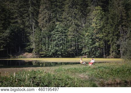 Zgornje Jezersko, Slovenia - September 14, 2021: Selective Blur On A Couple, Two Senior Persons, Rel