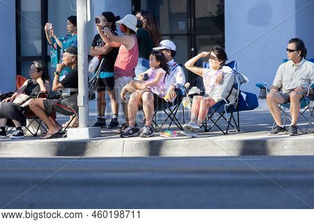 Los Angeles, Ca - August 14 2022: Japanese Father With His Daughter On His Lap Watching The Nisei Fe