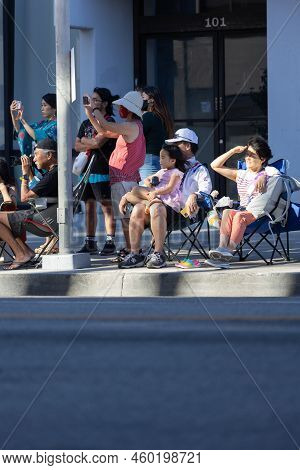 Los Angeles, Ca - August 14 2022: Japanese Father With His Daughter On His Lap Watching The Nisei Fe