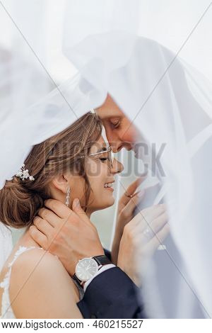 Closeup Vertical Portrait Of Smiling, Chancy Married Couple Of Young Woman In Glossy Dress And Groom