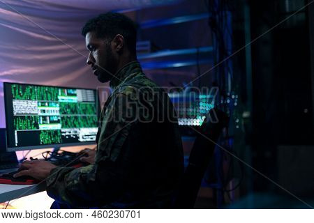 American Hacker In Military Unifrorm On Dark Web, Cyberwar Concept.