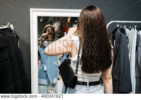 Second Hand. Sustainable Fashion. Young Latina Woman Buying Used Sustainable Clothes From Second Han