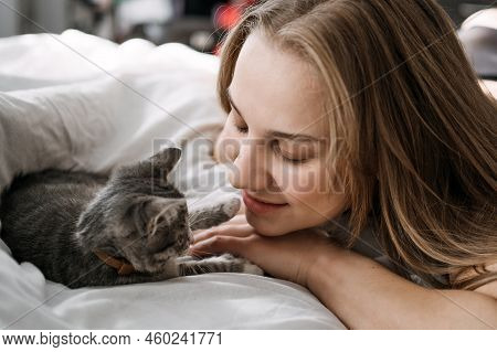 Cat Adoption, Adopt Kitten From Rescues And Shelters. Rehome A Cat. Portrait Of Woman Playing With O