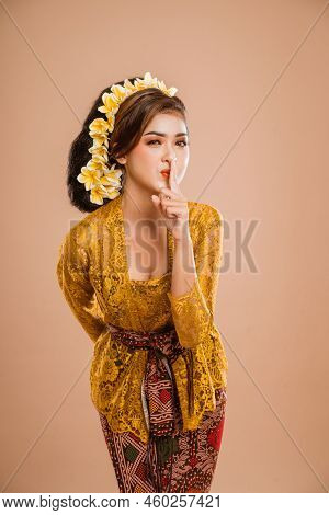 Balinese Woman With Kebaya Showing Be Quiet Gesture