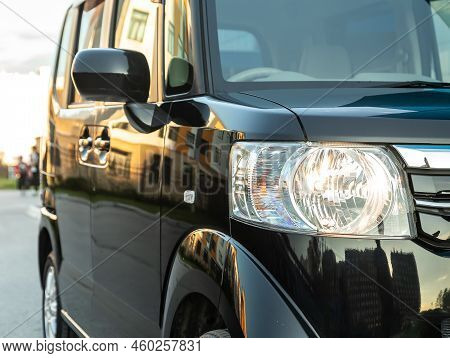 Novosibirsk, Russia -   August 03, 2022:   Honda N-box,   Close Up Of The Car Headlights. Exterior C