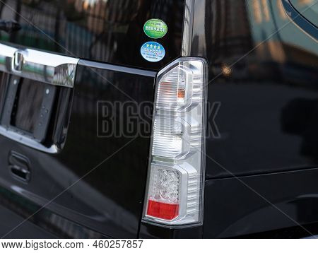 Novosibirsk, Russia -   August 03, 2022:   Honda N-box,   Back Of A  Black Car:  Bumper, Trunk Lid, 