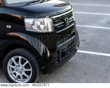 Novosibirsk, Russia -   August 03, 2022:  Black Honda N-box,  Side Glass, Wheel, Bumper And Hood