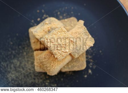 Top View Of Delectable Japanese Traditional Confection Called Warabimochi Covered With Kinako Flour