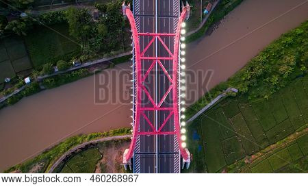 Aerial View Of The Kalikuto Bridge, An Iconic Red Bridge At Trans Java Toll Road, Batang When Sunris