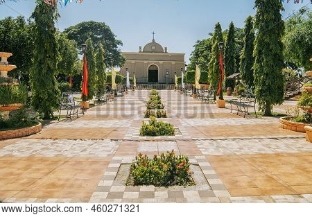 View Of A Beautiful Church In A Park With A Garden, Catholic Church In The Park Of Nagarote, Nicarag