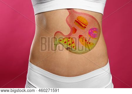 Woman With Image Of Stomach Full Of Junk Food Drawn On Her Belly Against Pink Background, Closeup. U
