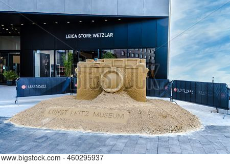 Wetzlar, Germany - 2021-10-01:  Leica Store In Wetzlar With Artwork, Leica Camera Modeled From Sand.