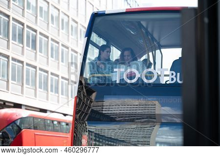 London - May 20, 2022: Tourists On Top Deck Of London Double Decker Bus