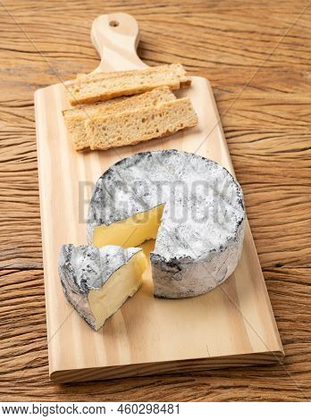 Brazilian Artisan Lua Cheia Cheese With Toasts Over Wooden Table.