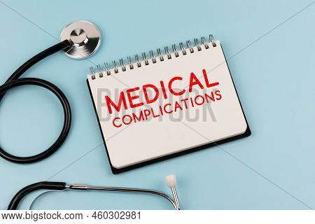 Medical Complications Text On Note Pad And Stethoscope