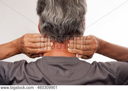 Mature Man 60plus Doing Back Of The Neck Stretches For Back And Neck Pain Relief