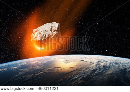 Planet Earth And Big Asteroid In The Space. Potentially Hazardous Asteroids. Asteroid In Outer Space